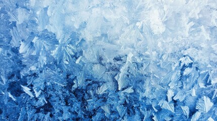 Fototapeta premium Frosty blue ice texture with intricate crystalline patterns, evoking the chill of winter, perfect for seasonal designs in close-up photo with clean background.