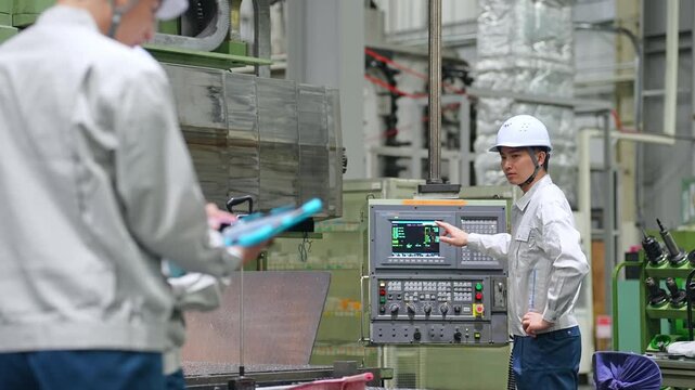 Group of workers working in a factory