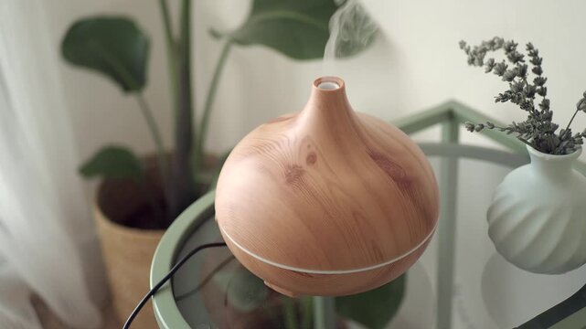 Wooden diffuser on a table in a green room setting