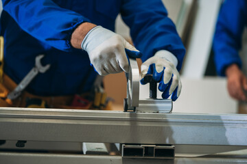Professional Woodworker Measuring, Cutting and Installing Timber in Factory. Carpentry and Wood Manufacturing Process in Industrial Workshop