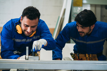 Professional Woodworker Measuring, Cutting and Installing Timber in Factory. Carpentry and Wood Manufacturing Process in Industrial Workshop