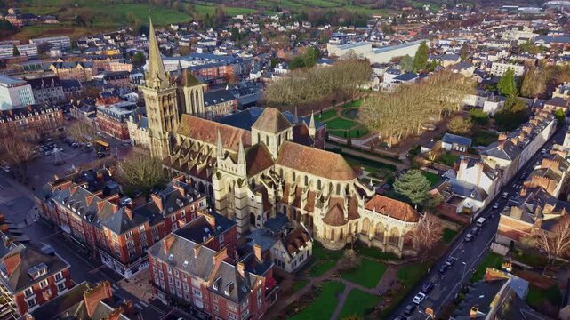 Beautiful early sunset drone panorama of the historic Lisieux Cathedral with settlement skyline, Lisieux, France