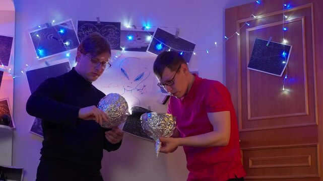 Men React With Alarm. Men Display Panic After Experiment. People Show Shock And Frenzy After Makeshift Helmet Test. Two Men Visibly Distressed And Frantic Following Improvised Helmet Trial