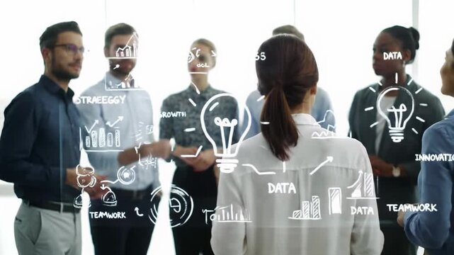 Diverse team in business-casual brainstorms with diagrams on an interactive display in a bright, minimalist office. gimbal push-in and panning videos. concept of collaborative strategic innovation