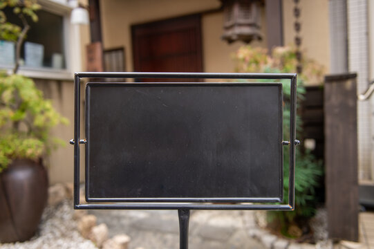 Large blank billboard on a street wall, banners with room to add your own text