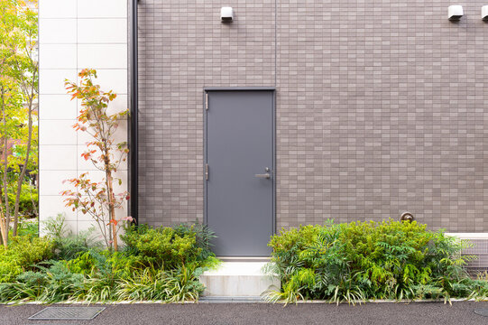 sidewalk by street wall  and  door