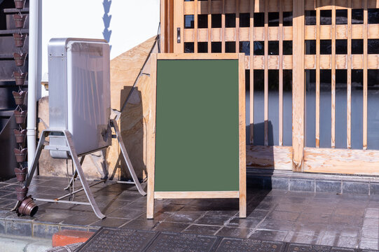 Large blank billboard on a street wall, banners with room to add your own text