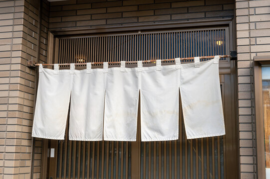 The curtain-like fabric that hangs in front of traditional Japanese restaurants and shops not only serves as a signboard, but holds a larger meaning,