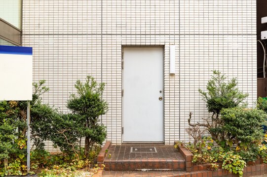 sidewalk by street wall  and  door