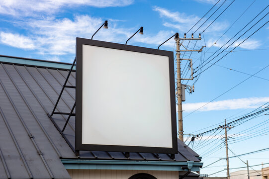 Large blank billboard on a street wall, banners with room to add your own text