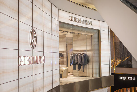 The flagship boutique of the famous Italian fashion house Giorgio Armani and the sign of the luxury brand Alexander McQueen at the ICONSIAM shopping mall in Bangkok, Thailand on December 19, 2025.