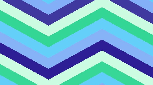 Dynamic chevron pattern in various shades of blue and green, creating a vibrant and modern geometric background suitable for digital displays and motion graphics