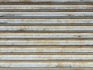 Fototapeta premium Weathered metal shutter texture with rust and peeling paint background