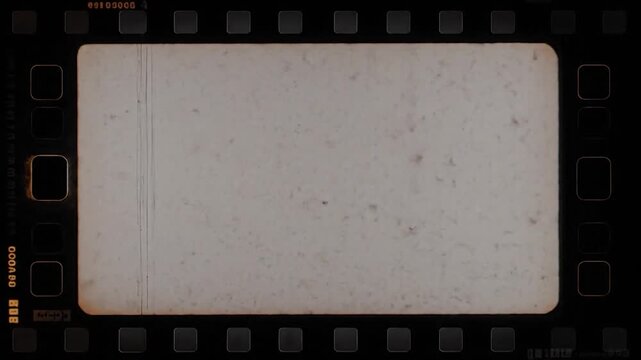 Vintage film strip with a central frame, showing scratches, dust and frame numbers