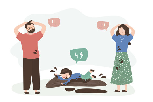 Dirty child is lying on floor, screaming and crying in mud. Kid having tantrum, hysteria. Parents can't cope with their child tantrum. Mom and dad stressed by little son behavior.