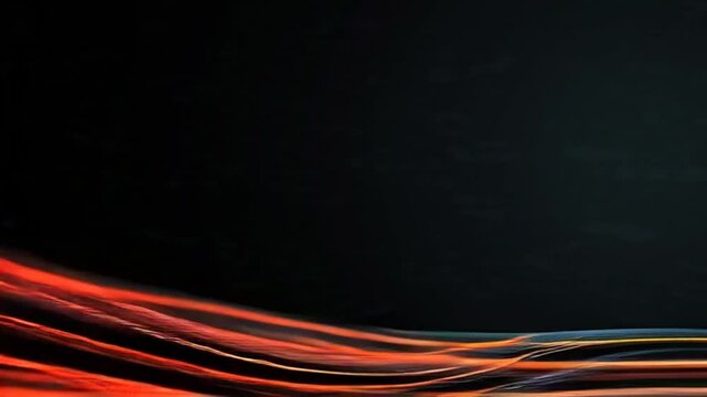 Vibrant orange and yellow vector eps lines wave across a dark background.