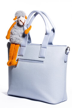 Women's blue leather bag on a white background