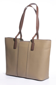 Beige women's leather bag on a white background