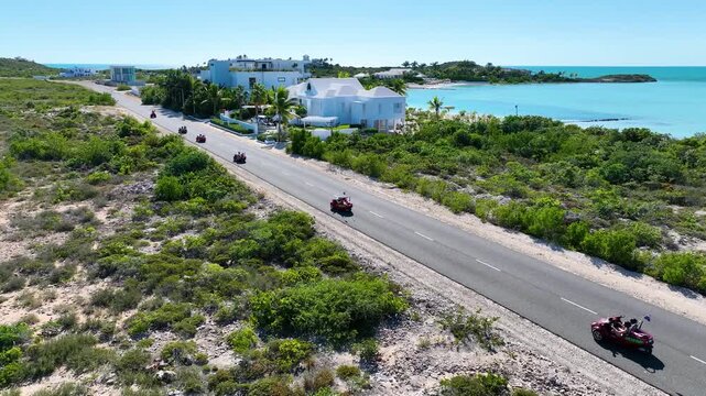 A group of buggies captured on drone on a remote road in Turks and Caicos