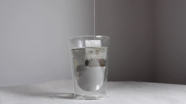 Video of teabag hitting hot water.