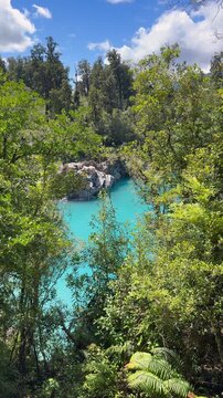 Turquoise river flowing through Hokitika Gorge, framed by native forest on the West Coast of New Zealand&rsquo;s South Island.