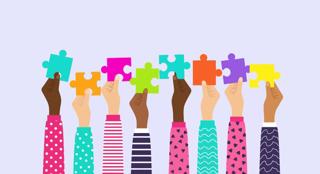 Diverse hands holding puzzle pieces together in unity and cooperation.