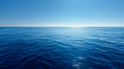 Fototapeta premium The sun shines brightly over a vast expanse of calm and serene ocean water