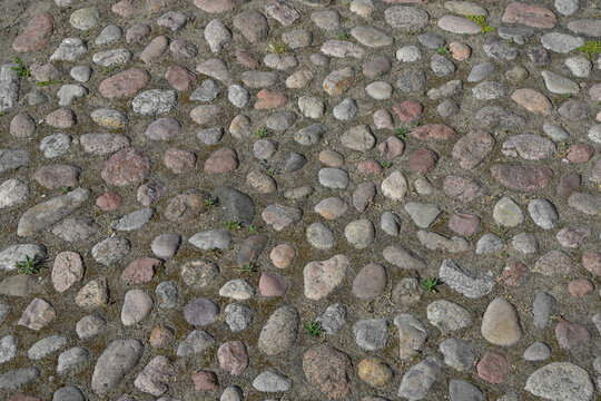Field stone paving, old road made of stones and cobblestones