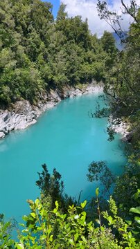 Turquoise river flowing through Hokitika Gorge, framed by native forest on the West Coast of New Zealand&rsquo;s South Island.