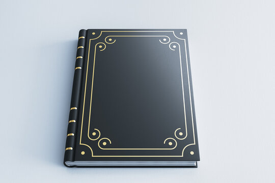 Black classic book cover mockup on light background with ornate gold frame details for clean contemporary design presentation."" 3D Rendering