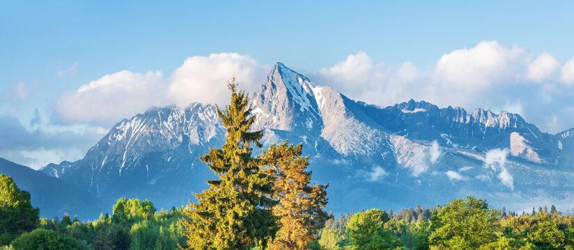 Krivan peak, High Tatras mountains, Slovakia national symbol, snow covered rocky massif, majestic alpine summit, high mountain hiking destination, mountaineering terrain, dramatic winter landscape, ic