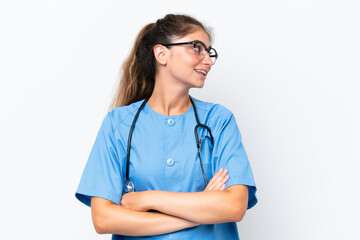 Young nurse doctor woman isolated on white background with arms crossed and happy