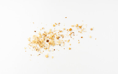 Obraz premium Grated wallnut , broken roasted walnuts, heap of nuts crumbs, whole kernel pieces, fractions