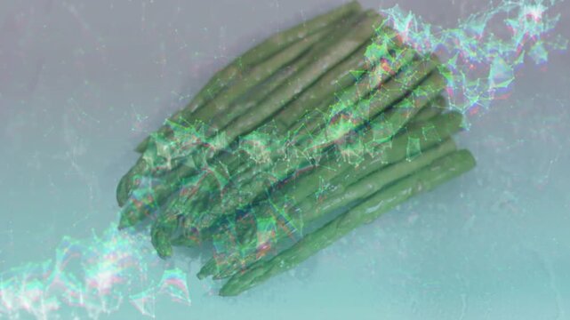 Green asparagus staying diagonal on board, overlay wave from right sweeping left showing freshness