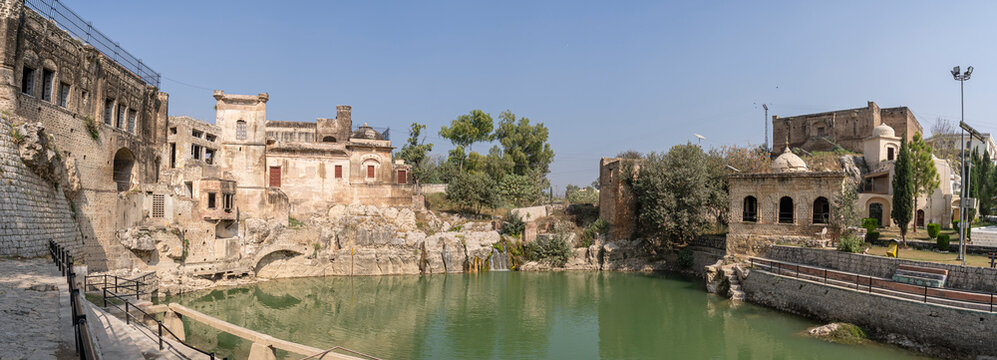 Landscape panorama of ancient Katas Raj hindu shiva temples and reflection on sacred pond, Chakwal, Punjab, Pakistan
