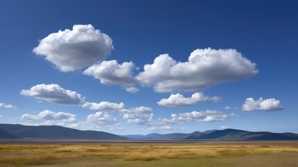 Serene Landscape with Blue Sky and Fluffy Clouds Over Rolling Hills and Vast Grassland Under Bright Afternoon Light in a Natural Scenic Area