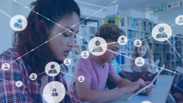 Students tapping tablets, studying in school library, overlay of user nodes growing across screens