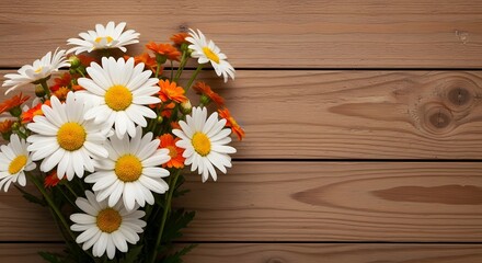 A bouquet of white daisies on a wooden background © Sabana Designs
