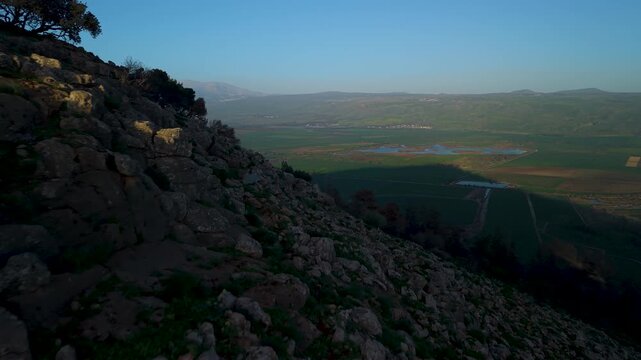 Hula Valley panorama from Ramim Ridge featuring Agamon Hula and colorful fields during golden hour light in Israel.