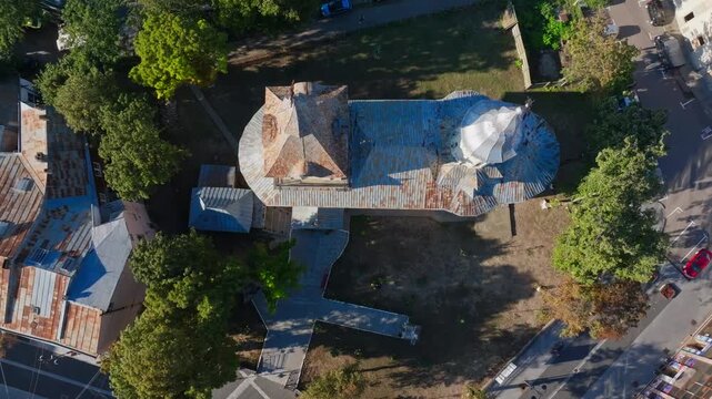 Botosani Church Top-down aerial view of the Uspenia church and the surrounding autumnal trees