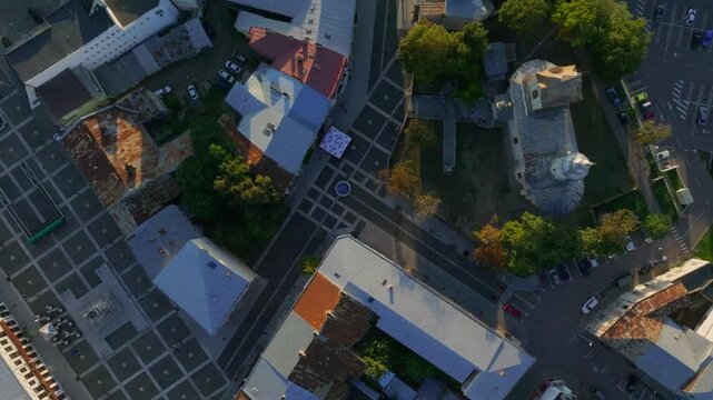 Slow rising spin showcasing historical center of Botosani, baroque architecture in Romania - aerial