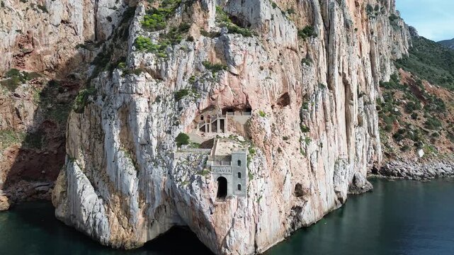 Historic Porto Flavia mining site carved into Sardinian rock