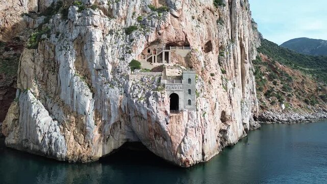 Historic Porto Flavia mining site carved into Sardinian rock
