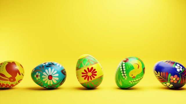 Hand painted easter eggs rolling in a seamless loop on a yellow background.