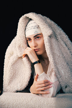 Portrait of a bald young woman with natural beauty and confident expression, isolated on neutral background. Concept of individuality, strength, self-acceptance, oncology awareness, alopecia