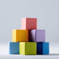 Fototapeta premium A group of colorful building blocks arranged in a tower, educational play and childhood development concept