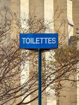 Public restroom French signage in the square area surrounding Notre-Dame de Paris Cathedral in France