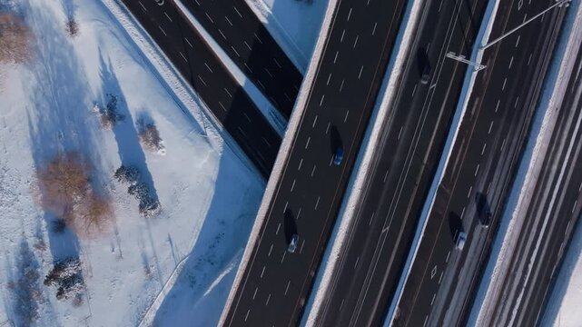 Aerial view of snowy HWY 401 in Mississauga, winter traffic flows smoothly