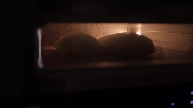 Timelapse of artisan bread baking in home oven, dough rising and crust forming