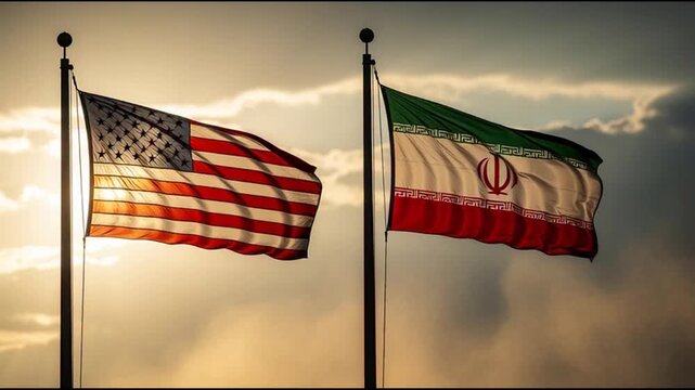 USA and Iran flags waving together against cloudy sky